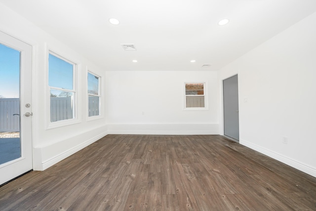 empty room with dark wood-type flooring