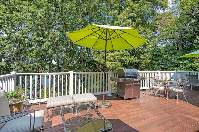 wooden deck featuring area for grilling