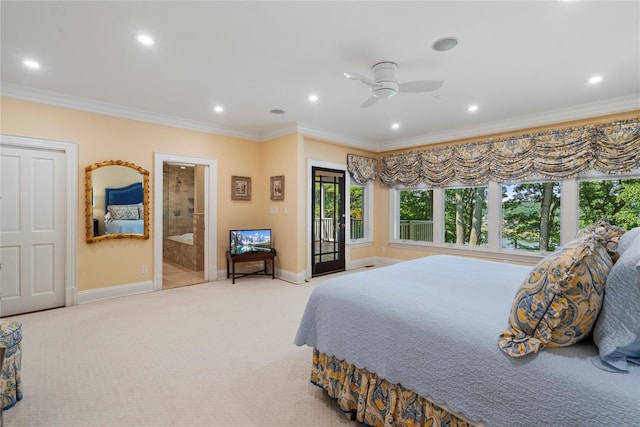 carpeted bedroom with ensuite bath, ornamental molding, and ceiling fan