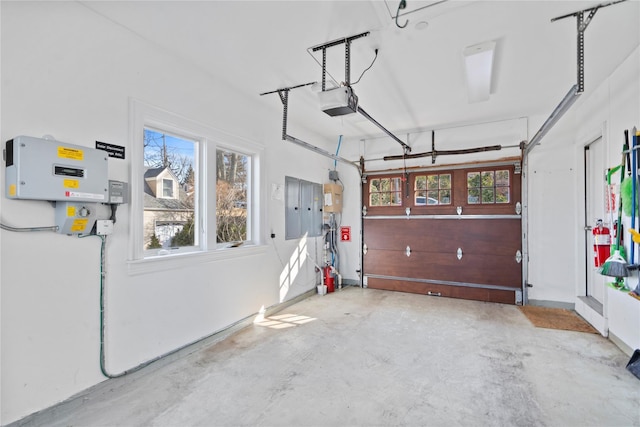 garage featuring a garage door opener and electric panel