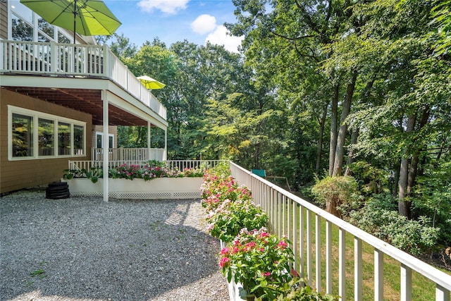 view of yard with a wooden deck