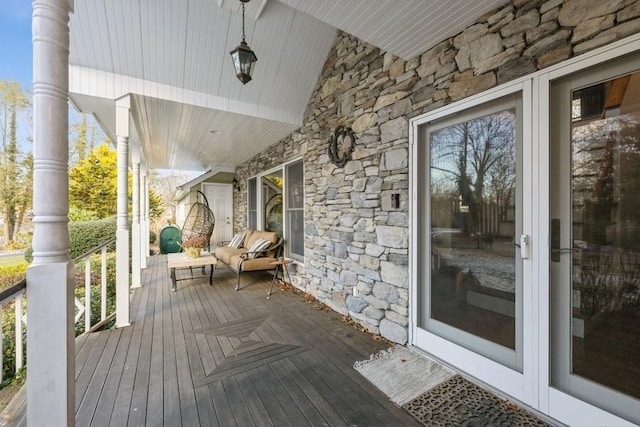 wooden terrace with a porch