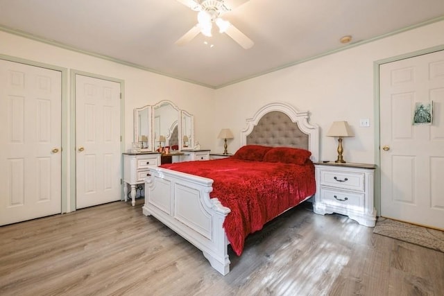 bedroom with light hardwood / wood-style floors, ceiling fan, and ornamental molding