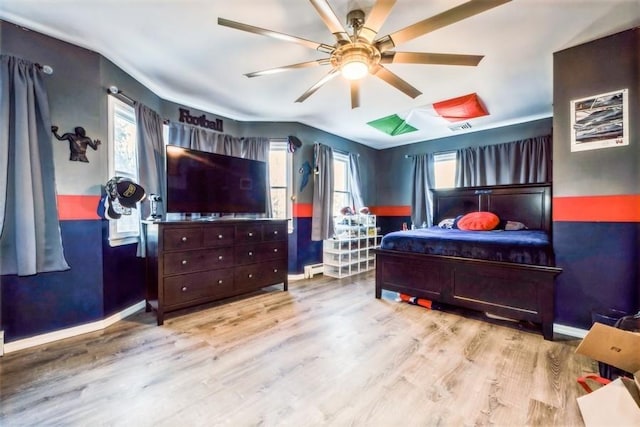 bedroom featuring light hardwood / wood-style flooring and ceiling fan