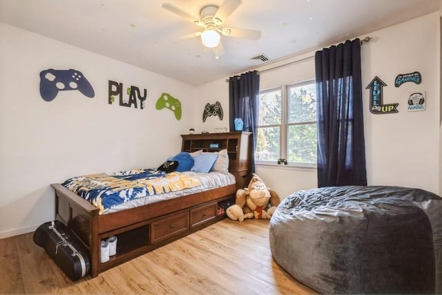 bedroom with hardwood / wood-style floors and ceiling fan