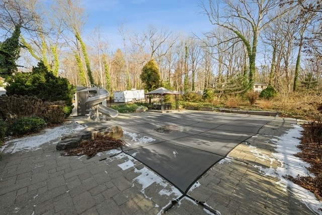 view of swimming pool with a patio