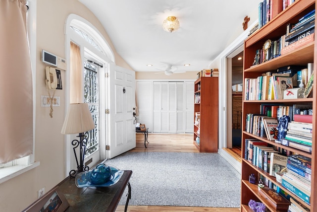 sitting room featuring hardwood / wood-style flooring, ceiling fan, and lofted ceiling