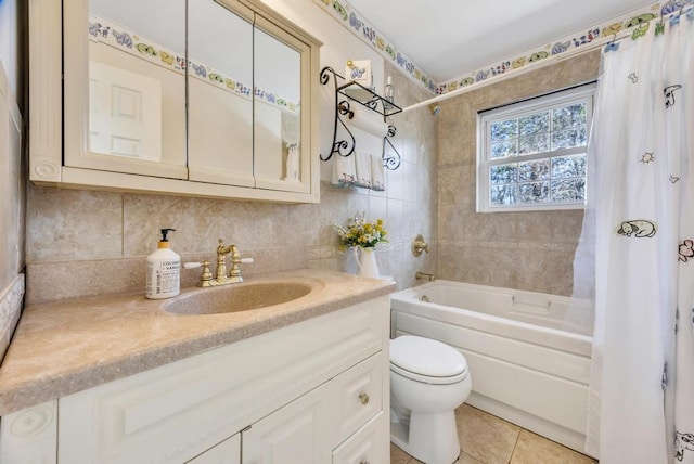 bathroom featuring toilet, tile patterned flooring, shower / bath combination with curtain, vanity, and tile walls