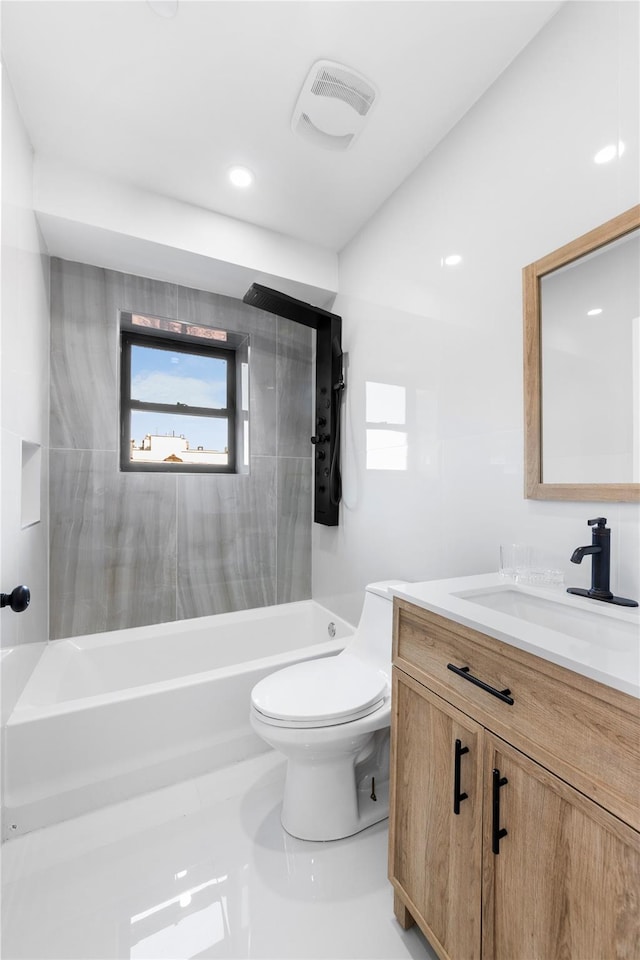 bathroom with vanity, toilet, and visible vents