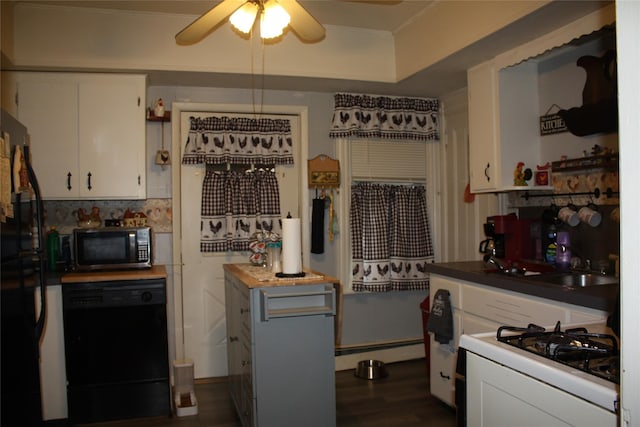 kitchen featuring wooden counters, black appliances, ceiling fan, a baseboard radiator, and white cabinetry