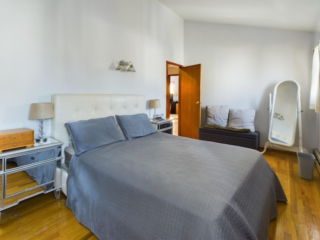 bedroom with hardwood / wood-style floors