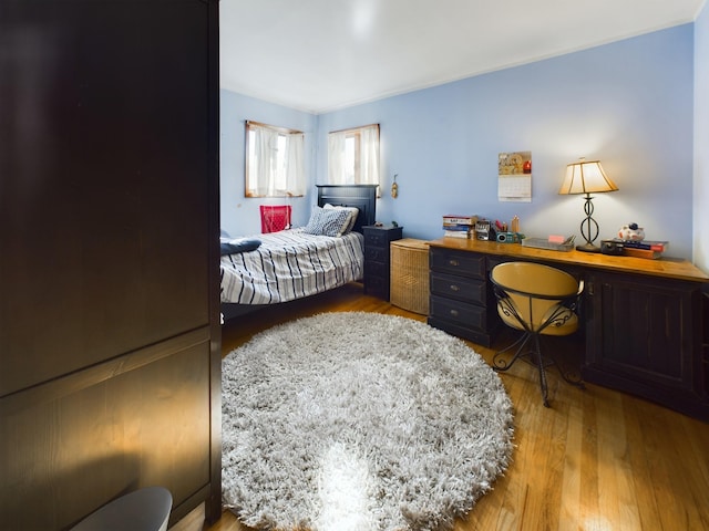 bedroom featuring wood-type flooring