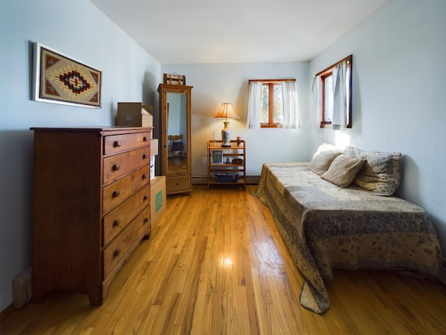 bedroom with light hardwood / wood-style floors