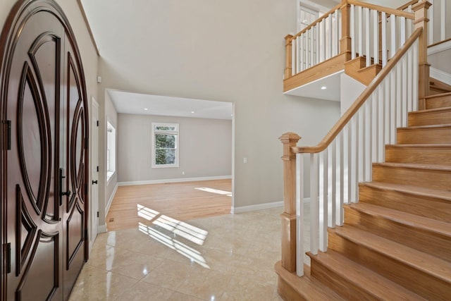 entryway featuring a high ceiling