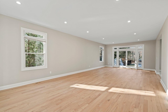 unfurnished room featuring light hardwood / wood-style flooring