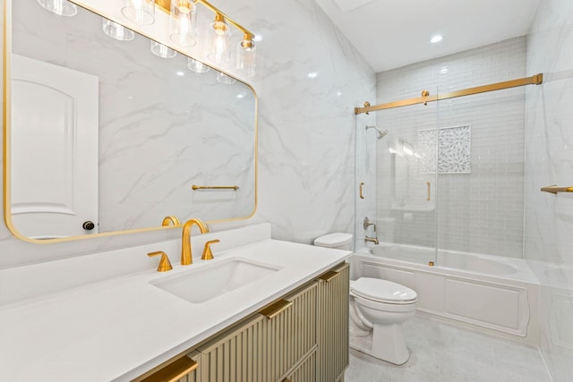 full bathroom featuring enclosed tub / shower combo, toilet, vanity, and tile walls