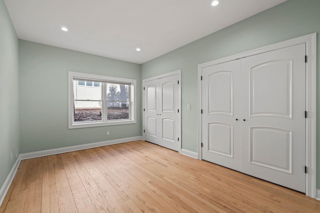 unfurnished bedroom featuring light wood-type flooring