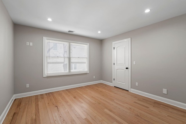 unfurnished room with light hardwood / wood-style flooring