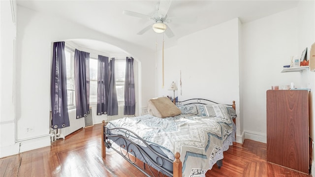 bedroom featuring radiator and ceiling fan