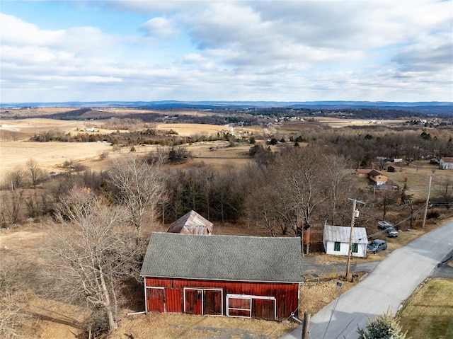 birds eye view of property with a rural view