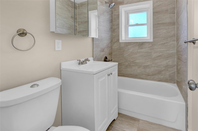 full bathroom featuring tile patterned floors, vanity, tiled shower / bath combo, and toilet