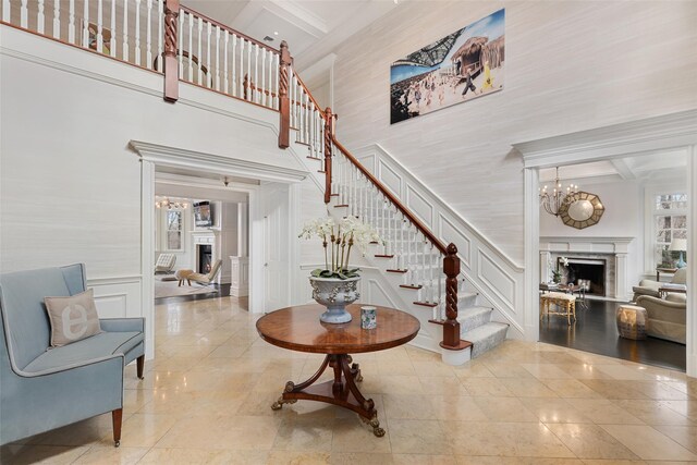 staircase with a lit fireplace and a decorative wall