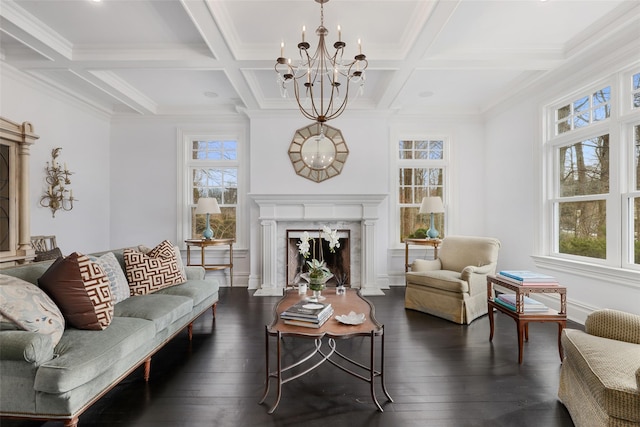 living room featuring dark wood finished floors, a notable chandelier, a wealth of natural light, and a premium fireplace