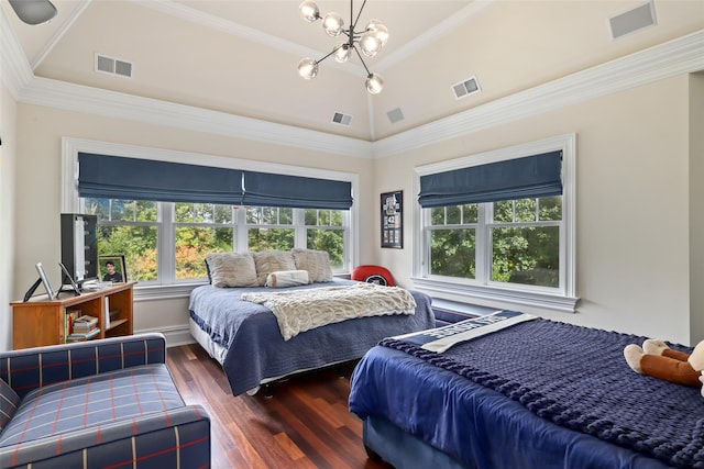 bedroom featuring visible vents, ornamental molding, and wood finished floors