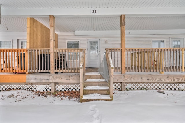 view of snow covered deck