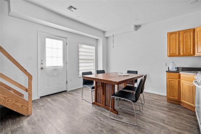 dining space featuring light hardwood / wood-style floors