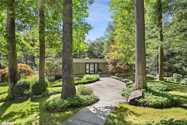 view of front of house with a front yard and a patio