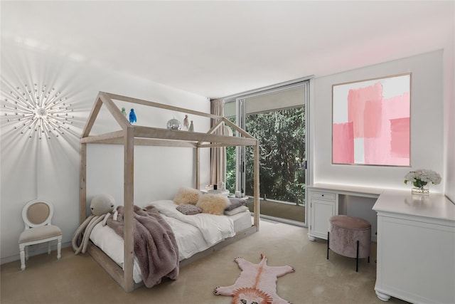 carpeted bedroom featuring floor to ceiling windows and access to exterior