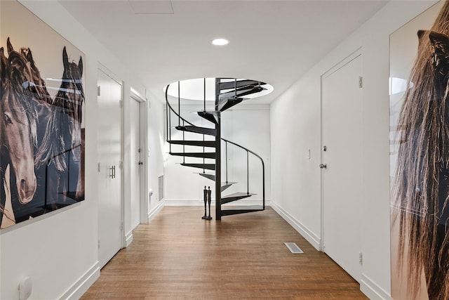 hall with wood-type flooring