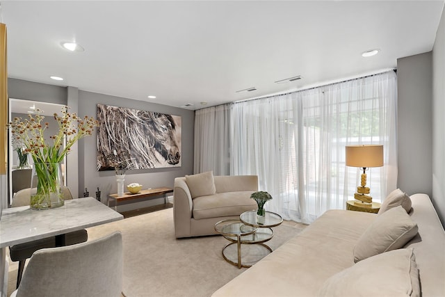 living room featuring floor to ceiling windows