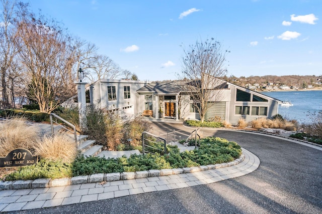 view of front of property with a water view