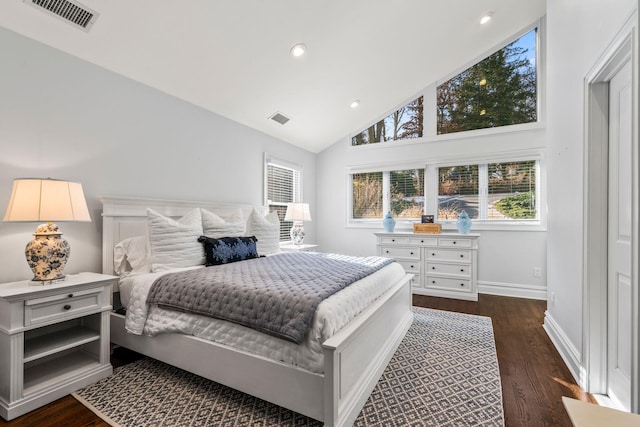 bedroom with dark wood-type flooring and vaulted ceiling