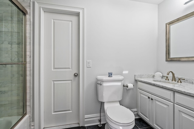 full bathroom with vanity, shower / bath combination with glass door, and toilet