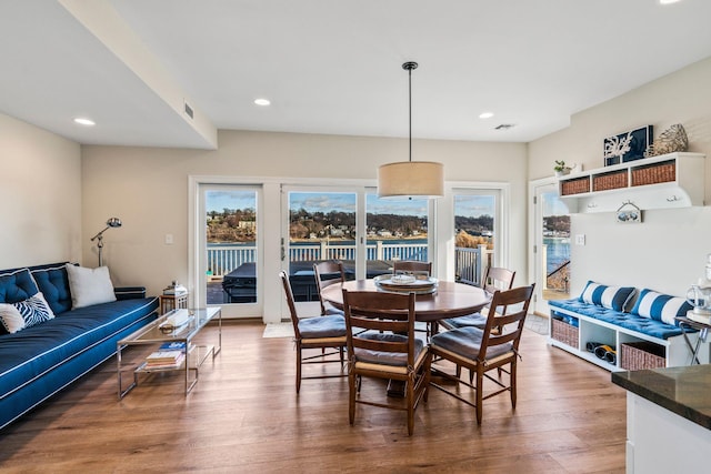 dining space with dark wood-type flooring