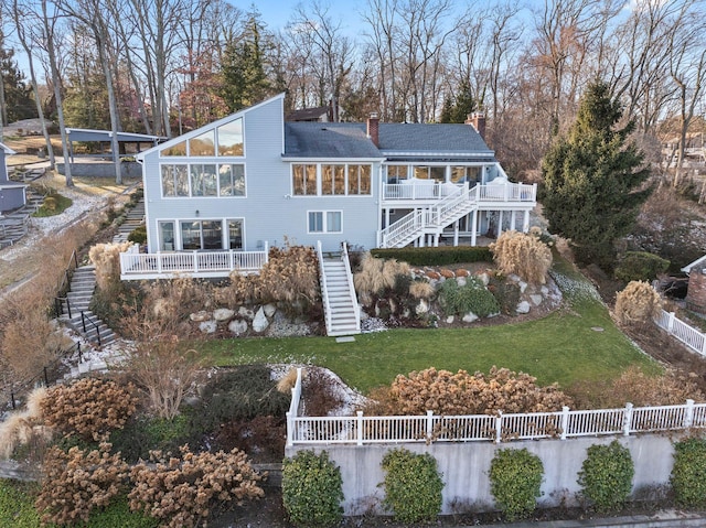 rear view of property with a yard