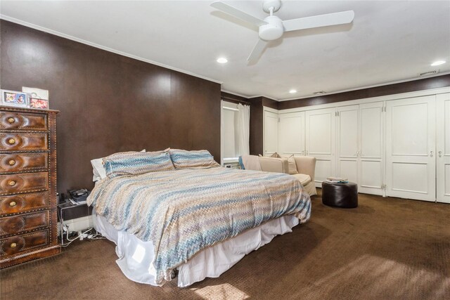 bedroom featuring ceiling fan, a closet, and dark carpet