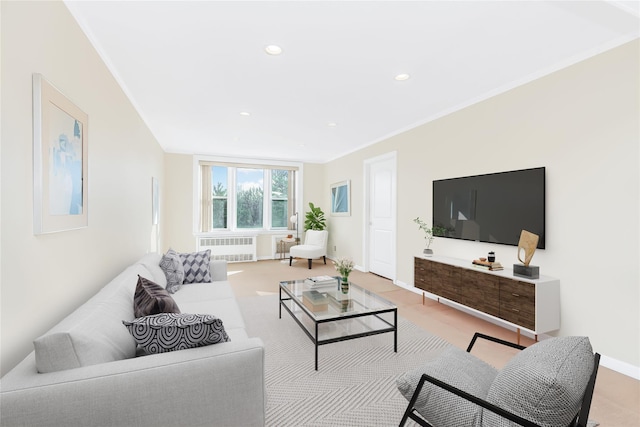 living room with crown molding and radiator heating unit