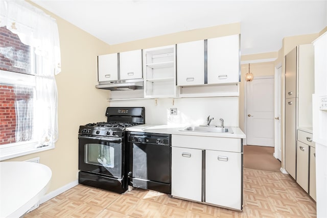 kitchen with white cabinetry, sink, light parquet flooring, and black appliances