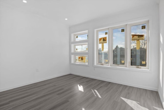 spare room with dark hardwood / wood-style flooring