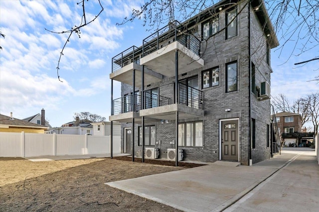 rear view of property with a balcony