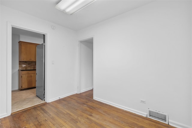 empty room featuring light hardwood / wood-style floors