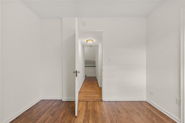 spare room with hardwood / wood-style floors