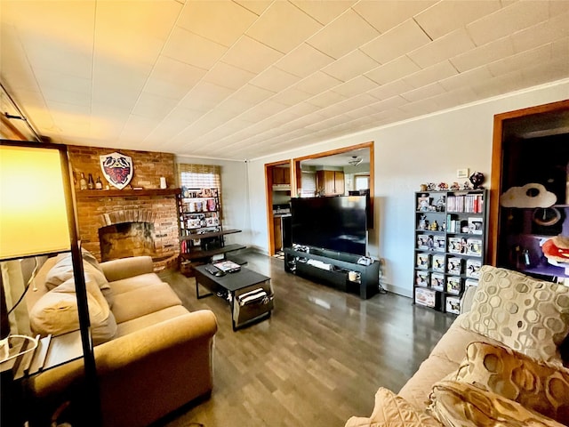 living room featuring a fireplace and crown molding