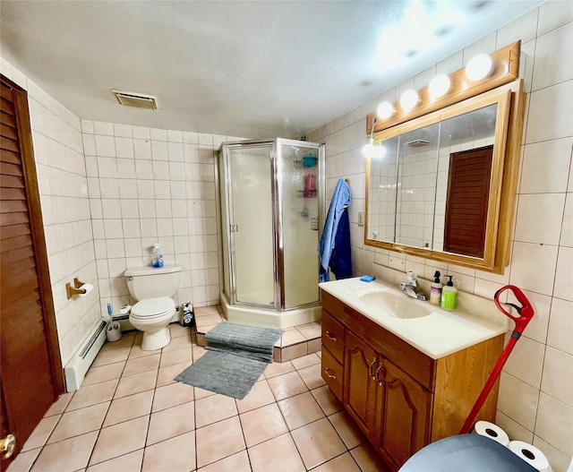 bathroom with a baseboard radiator, tile patterned floors, vanity, a shower with shower door, and tile walls