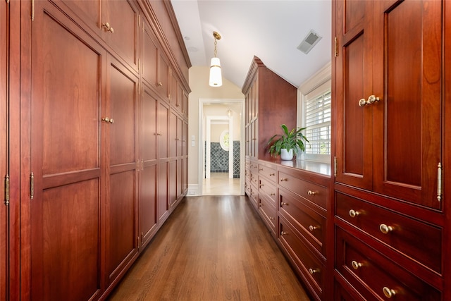 hallway with dark hardwood / wood-style floors