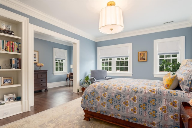 bedroom with crown molding, multiple windows, and dark hardwood / wood-style floors